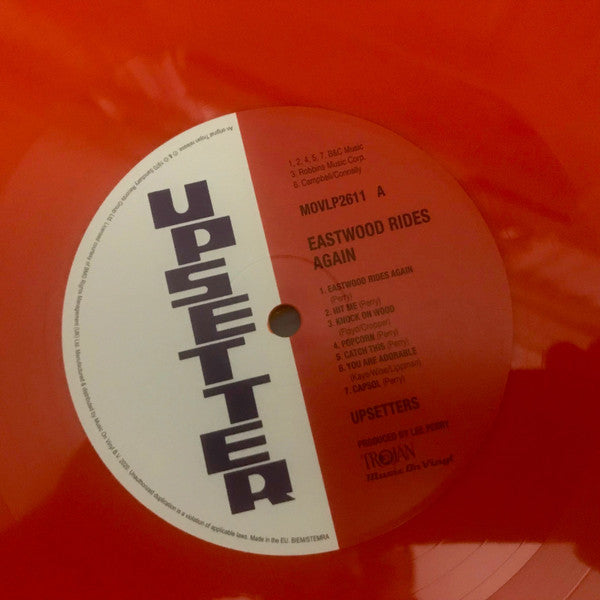 The Upsetters : Eastwood Rides Again (LP, Album, Ltd, Num, RE, Ora)